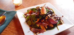 Fig Salad with Toasted Almonds and Charred Onions (Vegan) at Misters Bistro in Webb