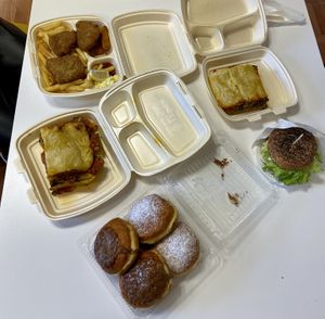 Vegan lasagnas, burger, seitan steaks with fries and donuts. at Radha Govinda in Ljubljana