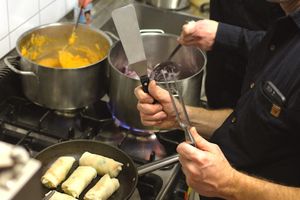 Preparing spring rolls during cooking class. at Publik Kitchen in Cologne