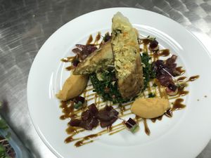 Spring roll with soy sauce reduction and kale flavoured with pomegranate. at Publik Kitchen in Cologne