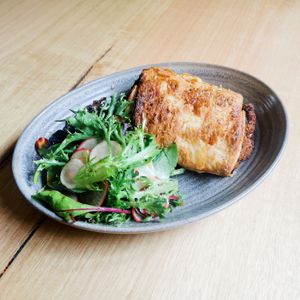 'Sausage' roll with green salad at The Carringbush Hotel in Abbotsford