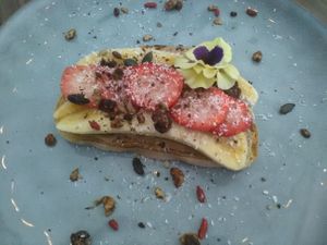 Banana and Strawberry toast with nut butter and cocoa nibbles. at The Jozi Green Eatery in Sandton