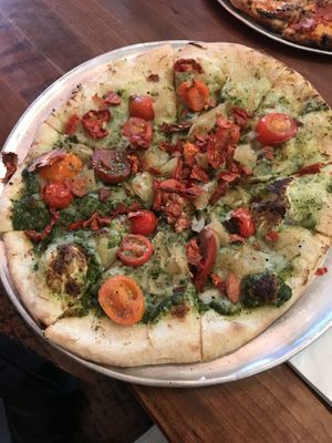 The Tomato Tomato pizza. They said the pesto is vegan! Only fully vegan pizza on the menu when I went. Sun dried tomatoes r sad /: but nice to have an option!  at Hand Fire Pizza in Jackson