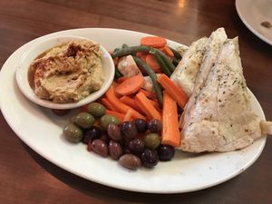 Hummus app! Love that they threw olives on there. The bread was sooooo good! I saw them fling it into the oven 😂  at Hand Fire Pizza in Jackson