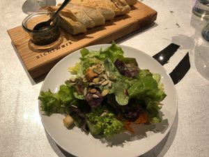 Salad and olives tapenade with baguette at Sichtwerk in Eimeldingen