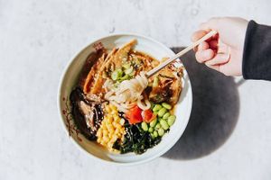 Vegan broth packed with umami flavours, topped with tempura veg, inari tofu, sweet corn, edamame beans, wakame seaweed, pickles & spring onion at Sushi Soldier Eightgrains  in Christchurch