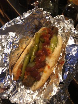 Veggie Dog topped with pickles, onion, hots, jalapeños,& sport peppers. (if you haven’t tried sport peppers you are missing out!) sorry for the low quality i was at work lol at Pip's Dock Street Dogs in Annapolis