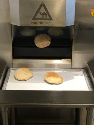Fresh pitas coming out of the oven  at Naf Naf Grill in Eagan