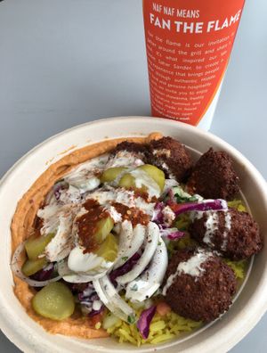 My free birthday bowl with the new spicy hummus. Good stuff. at Naf Naf Grill in Eagan