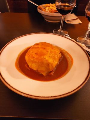 Francesinha vegan, with seitan, tofu, zucchini, bread, cheese and Kong sauce. Fries as side dish at Kong - Food Made With Compassion in Lisbon