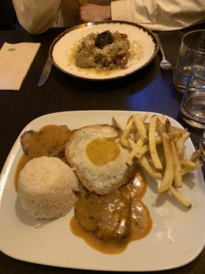 Bitoque: seitan steak with mustard-y sauce, very oily egg, fries and rice  at Kong - Food Made With Compassion in Lisbon