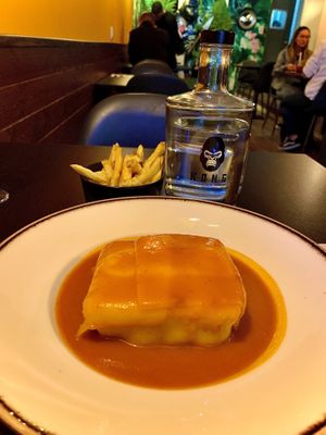 Francesinha (“Meat” sandwich wrapped in “cheese”, drenched in tomato and beer sauce)  at Kong - Food Made With Compassion in Lisbon