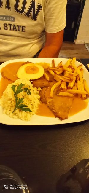 Seitan steak with mustard sauce, "egg", rice and fried at Kong - Food Made With Compassion in Lisbon