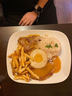 Seitan steak with rice and fries and vegan egg at Kong - Food Made With Compassion in Lisbon