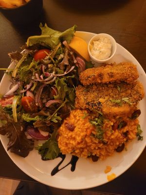 Fish with rice and beans and salad at Kong - Food Made With Compassion in Lisbon