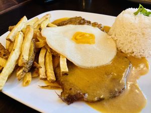 Bitoque - seitan steak with fried “egg"  at Kong - Food Made With Compassion in Lisbon