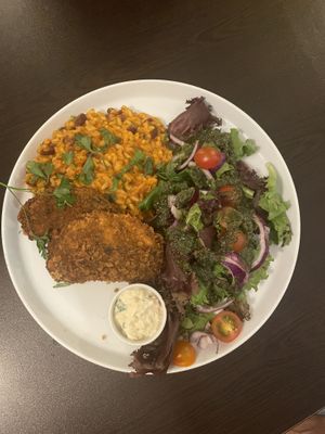 Fish with tomato bean rice and salad  at Kong - Food Made With Compassion in Lisbon
