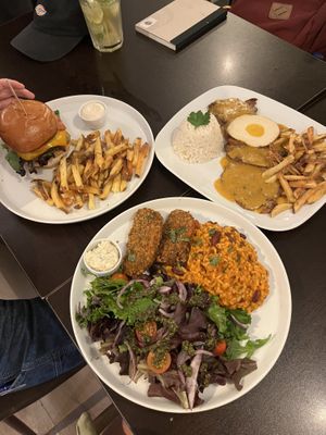 Burger, steak, and fish plates  at Kong - Food Made With Compassion in Lisbon