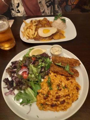 Blurry steak, egg and chips, and a deep fried "fish" with rice and beans at Kong - Food Made With Compassion in Lisbon