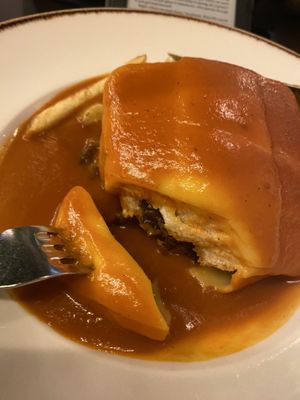 Cutting into the francesinha - tofu, mushroom, chorizo, cheese… delicious   at Kong - Food Made With Compassion in Lisbon