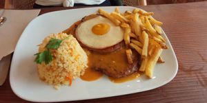Seitan steak and egg with rice and fries at Kong - Food Made With Compassion in Lisbon