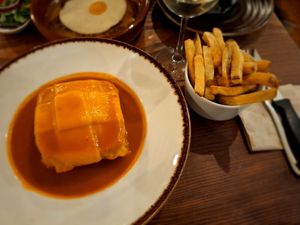 Francesinha que viene también con las patatas. at Kong - Food Made With Compassion in Lisbon