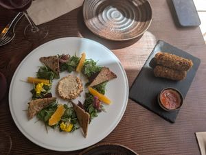 Homemade cheese (L) and Chorizo croquettes (R) at Kong - Food Made With Compassion in Lisbon