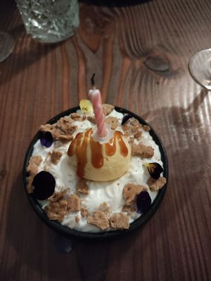 Dessert with birthday candle at Kong - Food Made With Compassion in Lisbon