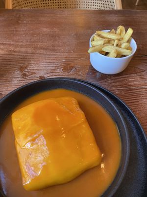 francesinha and friesnds  at Kong - Food Made With Compassion in Lisbon