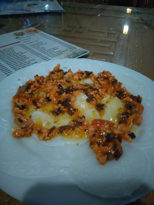 Rice steamed cake with tofu topping at Bo De in Hue