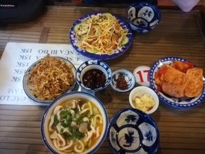 Vegan udon noodle soup, fried jackfruit with sesame, fried noodles and tofu with tomato sauce at Lien Hoa in Hue