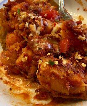 Loaded Sweet Potato from Atlantis Vegan Grill. I added the crushed red pepper. So tasty, and large portion size! at Atlantis Vegan Grill in St Charles