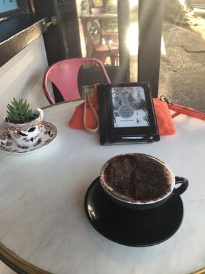 Macadamia hot chocolate, while reading outside. at Saabi Cafe in Hendra