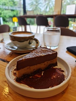Almond milk latte and the peanut butter raw cheese cake. at Deli Devi in Koh Phangan
