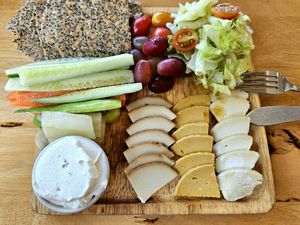 Cheese platter with truffle cheese, cheddar, and smoked cheese at Deli Devi in Koh Phangan