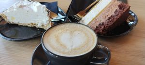 Lemon cheesecake (GF), jaffa cake and coffee with oat mylk at Tavci Kuhna in Lesce