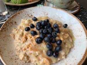 Peanut butter porridge with bananas and blueberries - perfect 🤩   at Cafe Drechsler in Vienna