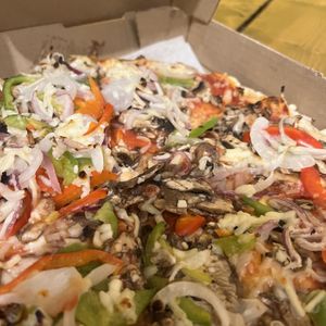 Close up build your own with mushrooms, bell peppers and onions, side garlic dip  at The Pizza Castle and Indian Curry in Vancouver