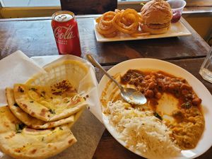 Curry buffet with fresh naan and "chicken" burger at The Pizza Castle and Indian Curry in Vancouver