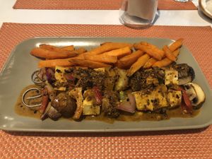 Tofu and veggie kebab with yam fries.   at True Food in Faro