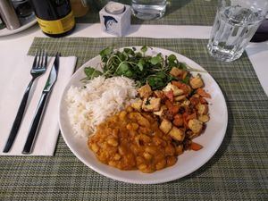 Marinated tofu with almonds and chestnuts, thai rice and white beans. at True Food in Faro