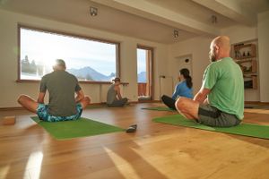 Daily yoga watching the sunrise over the mountains at MoaAlm Mountain Retreat in Kals Am Grossglockner