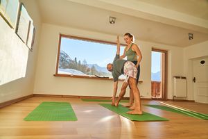 Panoramic yoga studio with daily classes at MoaAlm Mountain Retreat in Kals Am Grossglockner