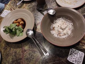 Gnocchi and pecorino cheese, and potatoes and jus stout at Fava Tonka in Matosinhos