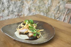 Textures of parsnip, shiitake, slow cooked egg, burnt onion and miso demi glace, watercress   at Arkhe in Lisbon