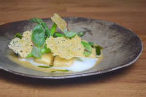 Potato gnocchi and black garlic, green asparagus, parmesan tuile, herbal oil at Arkhe in Lisbon