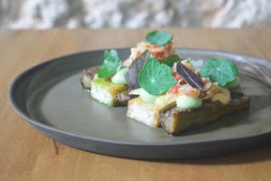 Rice terrine, roasted aubergine with teriyaki sauce, avocado cream, sambal, nasturtium at Arkhe in Lisbon