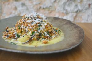 Celery root taglierini carbonara served with cured sheep’s cheese, mushrooms and leek crumble. at Arkhe in Lisbon