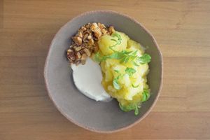 Pineapple and ginger granita, rum & coconut cream, roasted pineapple, almond praline, huacatay  at Arkhe in Lisbon