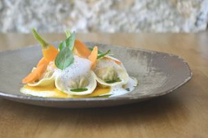 Kimchi tortellini, texturas de cenoura, espuma de parmesão, azeite de ervas  at Arkhe in Lisbon